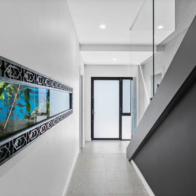 Modern hallway with staircase at 12 Pillars Place, Matraville — crafted by Sydney East Building & Renovations.