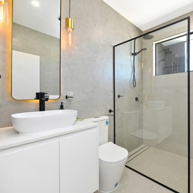 Nice, minimalist and modern bathroom designed by Sydney East Building & Renovations at 91 King Street, Mascot.