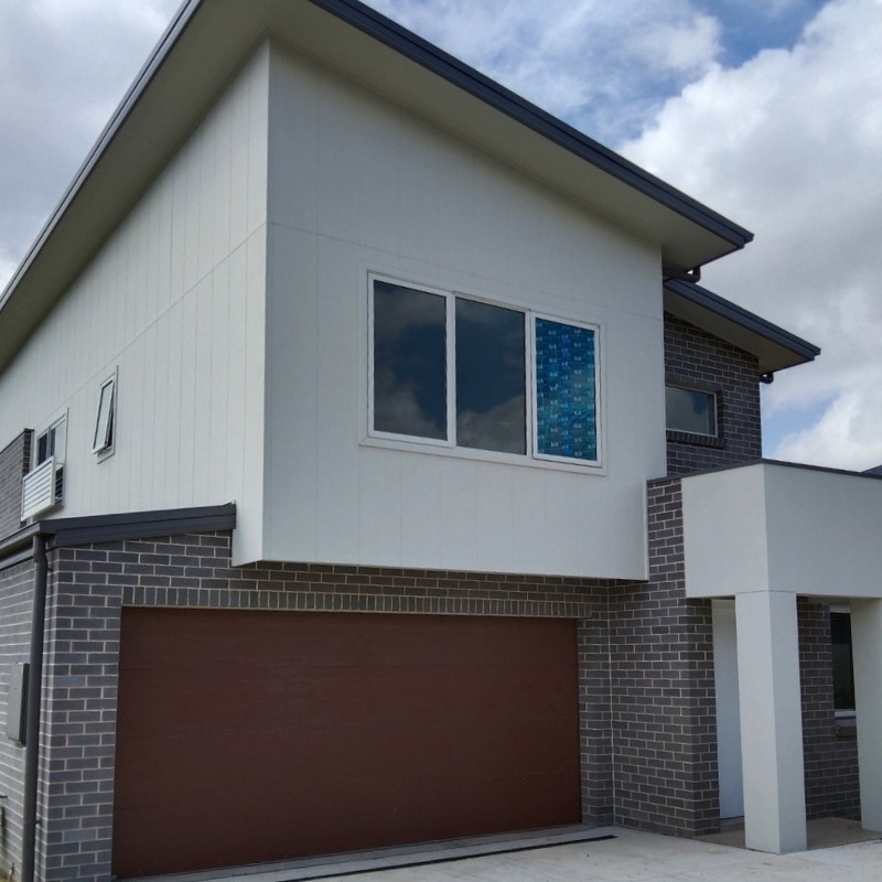 Brick-type house with garage space located at Leppington, built by Sydney East Building & Renovations.