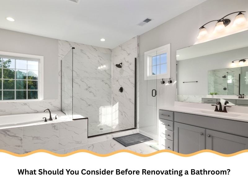 Finished result after renovating a bathroom with glass shower and modern vanity