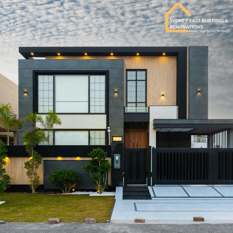 Modern double storey home with sleek black façade and landscaped garden by Double Storey Home Builders In Eastern Suburbs.