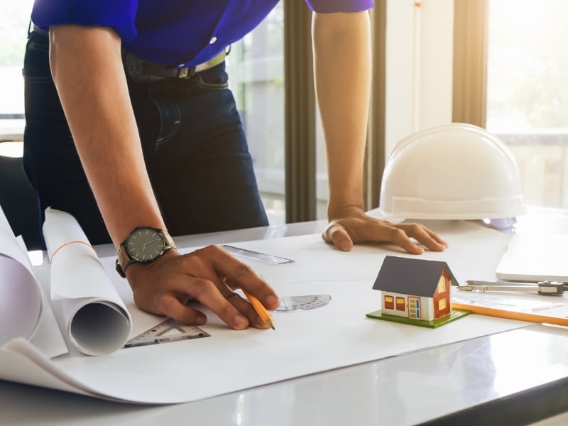 Drafting plans for a small granny flat using scale tools and model