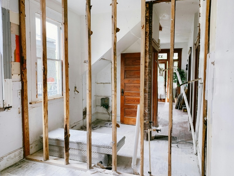 Exposed wall framing inside ongoing double storey house renovation.